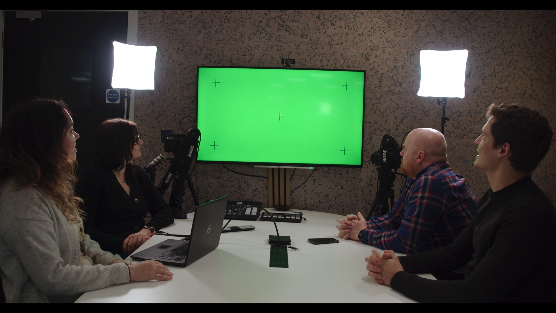 employees in the boardroom looking at green screen in wellmeadow recruitment video