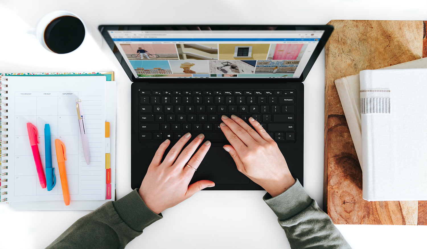 Person typing on a laptop with a blog on screen