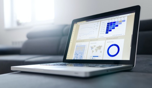 A content auditing software dashboard displayed on a laptop