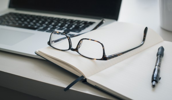 Pair of glasses on a notebook